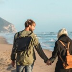 stock-photo-horizontal-banner-with-hipster-young-couple-in-love-walking-together-at-sunset-along-the-desert-2101641889-transformed