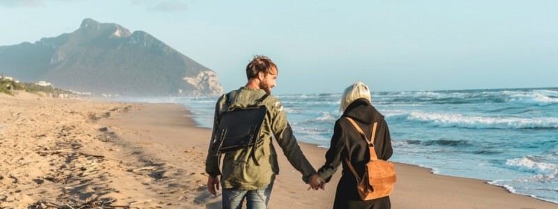 stock-photo-horizontal-banner-with-hipster-young-couple-in-love-walking-together-at-sunset-along-the-desert-2101641889-transformed